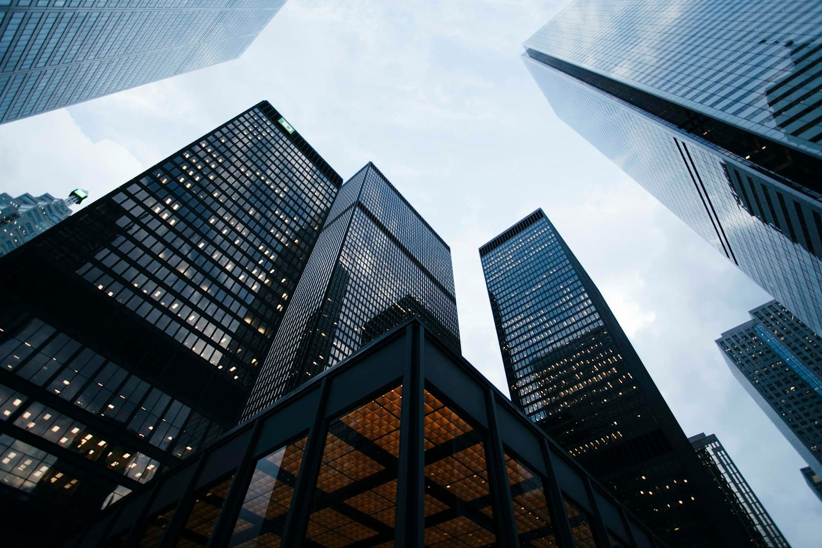 Glass office towers seen from street level.