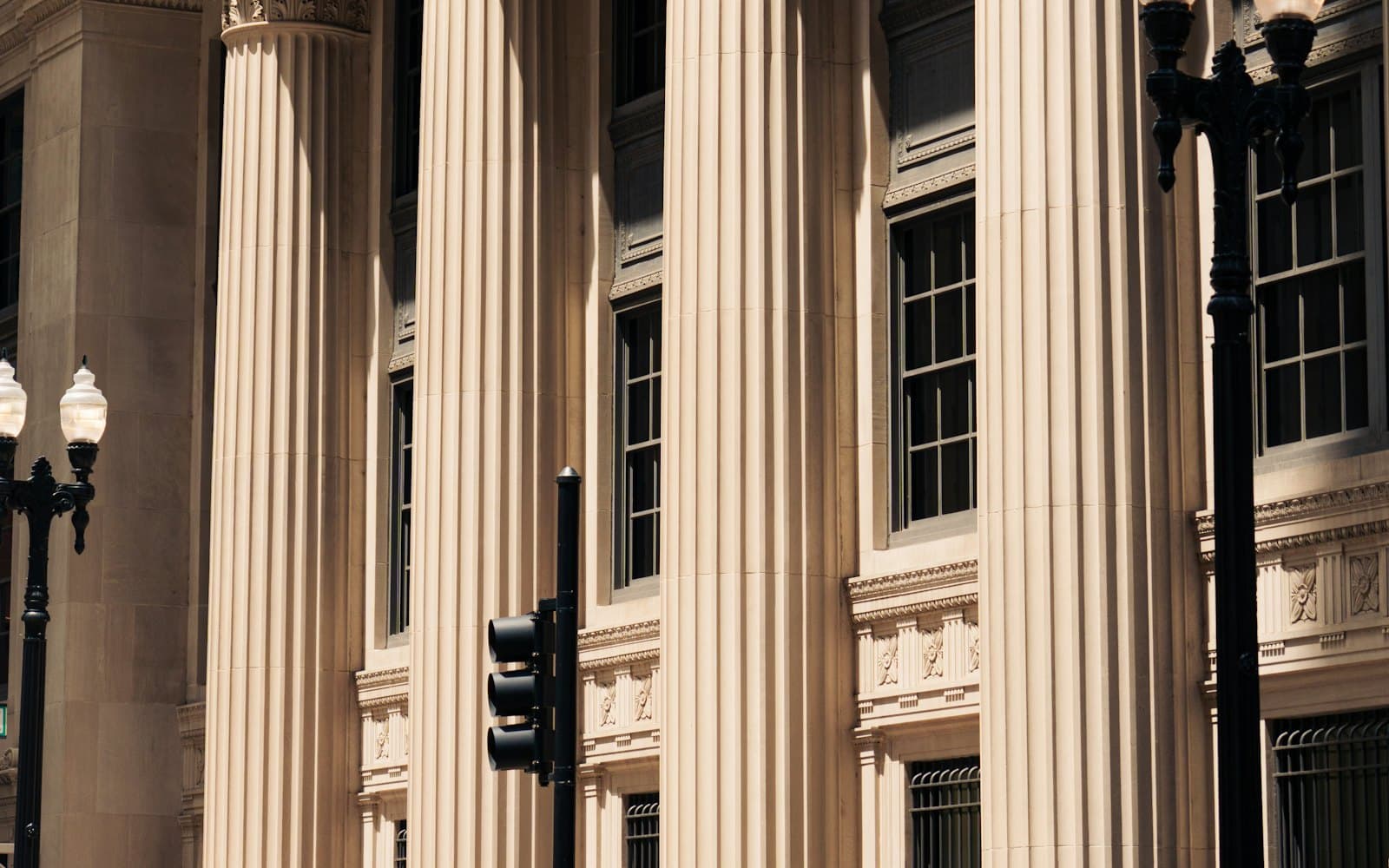 The columned facade of a bank in a financial district.