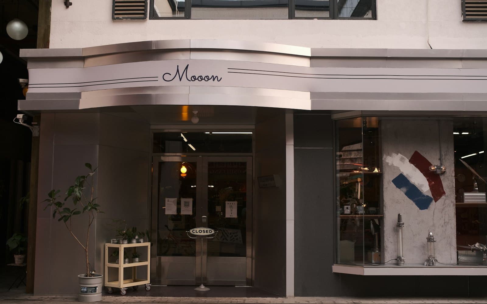 A modern retail storefront on a shopping street.